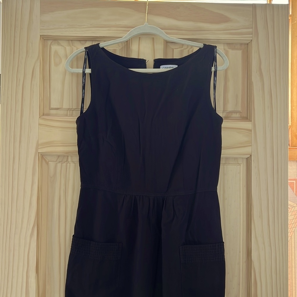 Calvin Klein, black jumpsuit. 
Size US 10
Large pockets with stitches
Wide leg